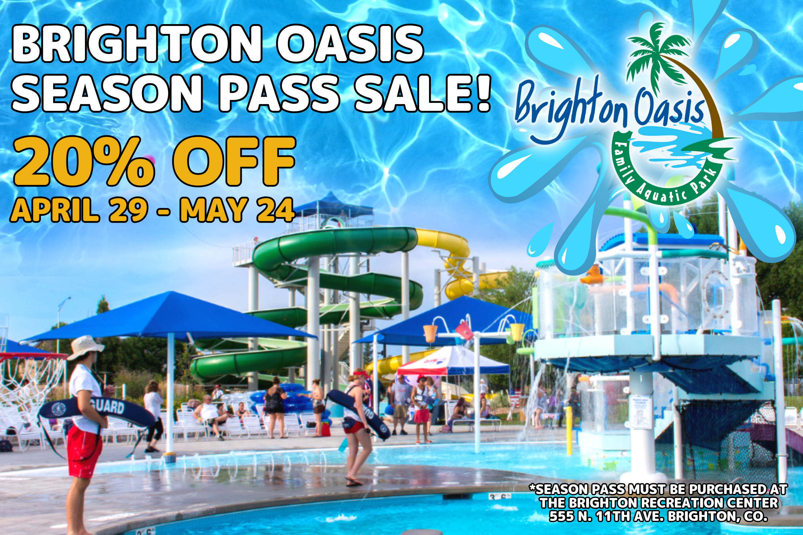 outdoor water park play feature with water slides in background. Lifeguards standing and keeping gua