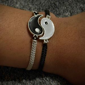 Photograph of a homemade bracelet with a yin-yang sign on it.